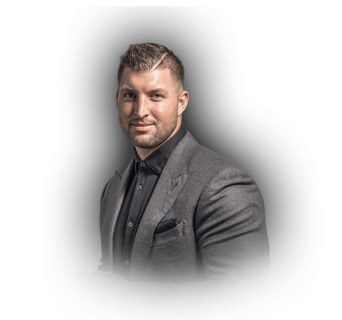 Tim Tebow wearing suit